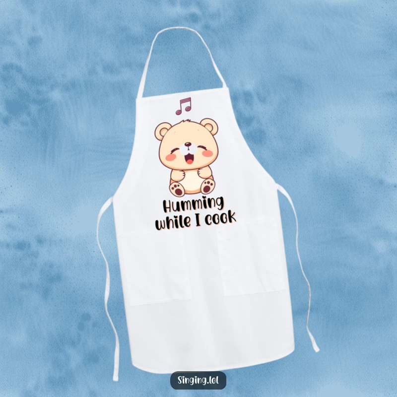 Funny Apron showing a happy bear cub singing with eyes closed, a musical note nearby, perfect for kitchen activities.