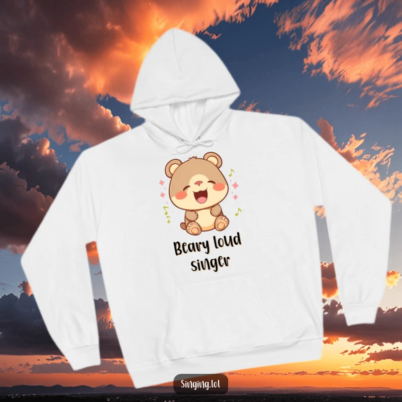 Funny hoodie depicting a playful bear cub with a huge smile, singing energetically and radiating happiness.