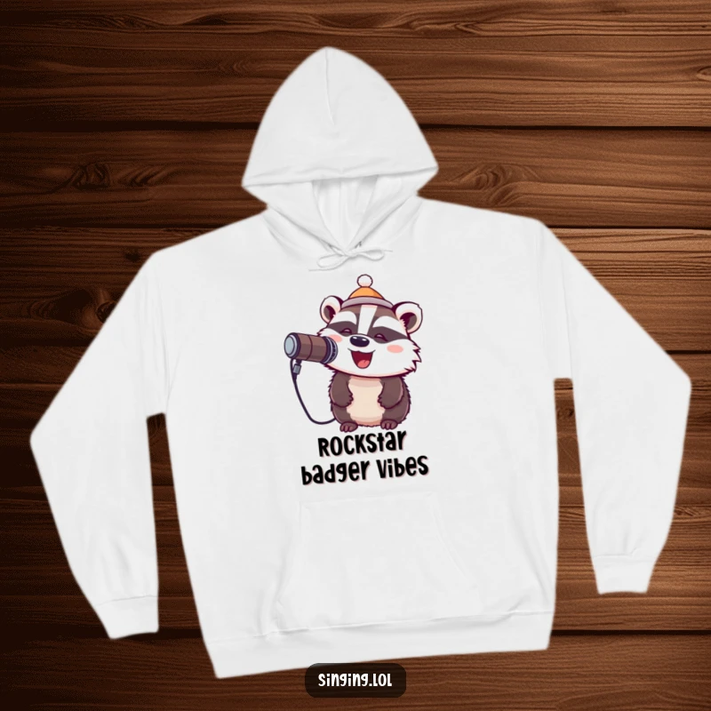 Funny hoodie depicting a cheerful badger wearing a tiny hat and singing into a microphone, offering warmth and musical vibes.