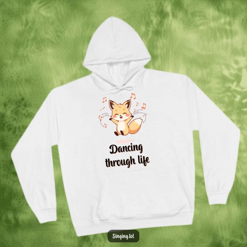 Funny hoodie featuring a little fox character dancing joyfully amid swirling musical notes, offering warmth and vibrant, rhythmic cheer.