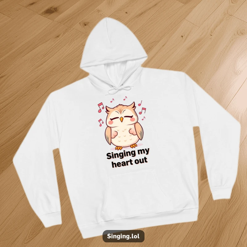 Funny hoodie featuring a cheerful owl character singing with eyes closed amongst floating musical notes, perfect for cozy leisure.