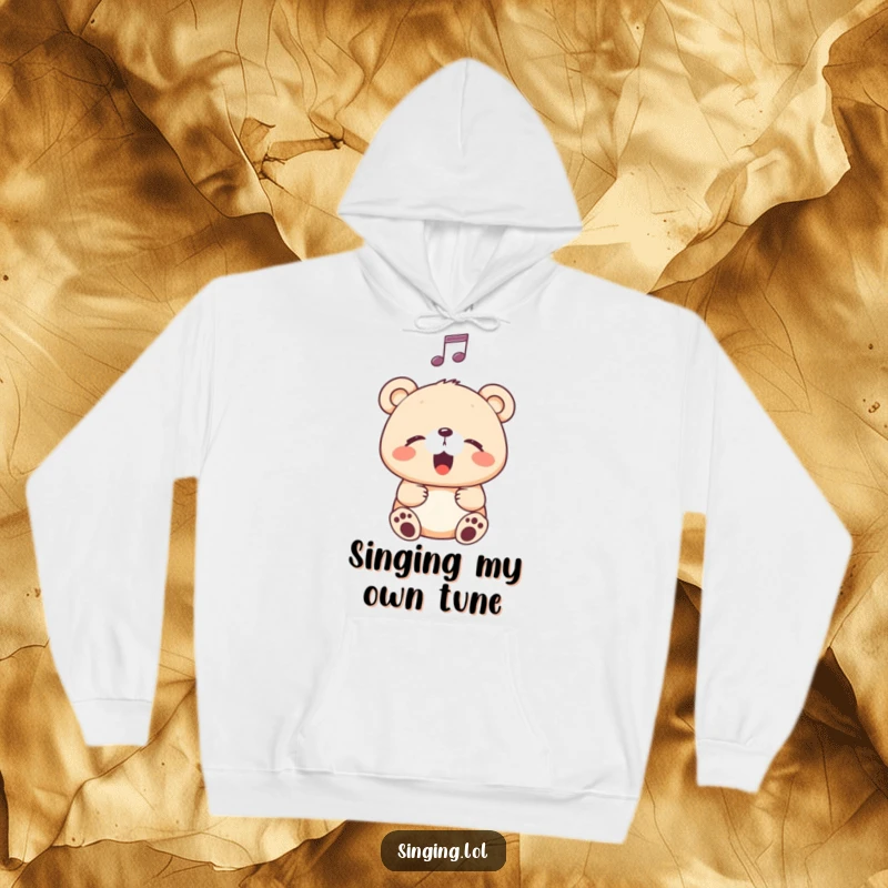 Funny Hoodie showing a happy bear cub singing contentedly with eyes closed, a musical note hovering, perfect for music lovers.