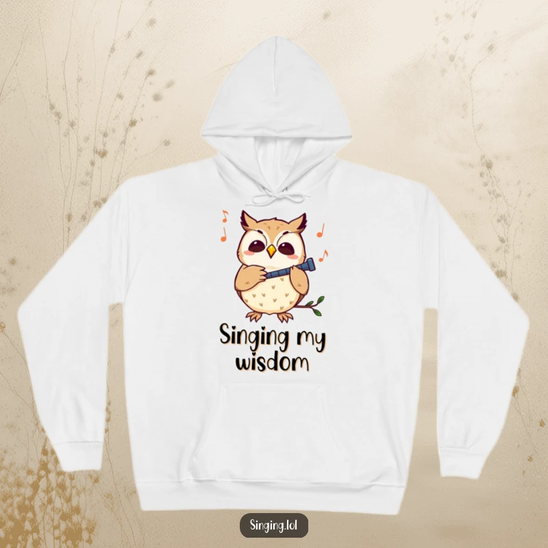Funny owl hoodie featuring a curious owl character hooting softly to a melody, radiating peace and warmth.