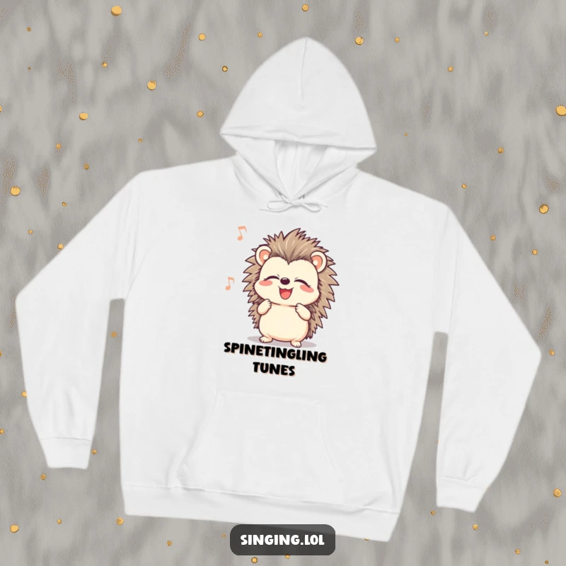 Funny smiling hedgehog character with closed eyes, singing joyfully, featured on a cozy hoodie for warm, humorous vibes.