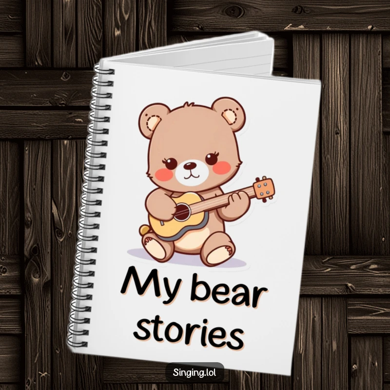 Funny notebook cover featuring a playful bear cub character strumming a miniature guitar, ideal for writing song lyrics and musical ideas.