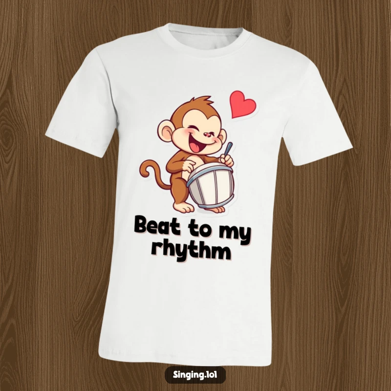 Funny monkey t-shirt showcasing a mischievous monkey character energetically drumming with excitement and a playful look.