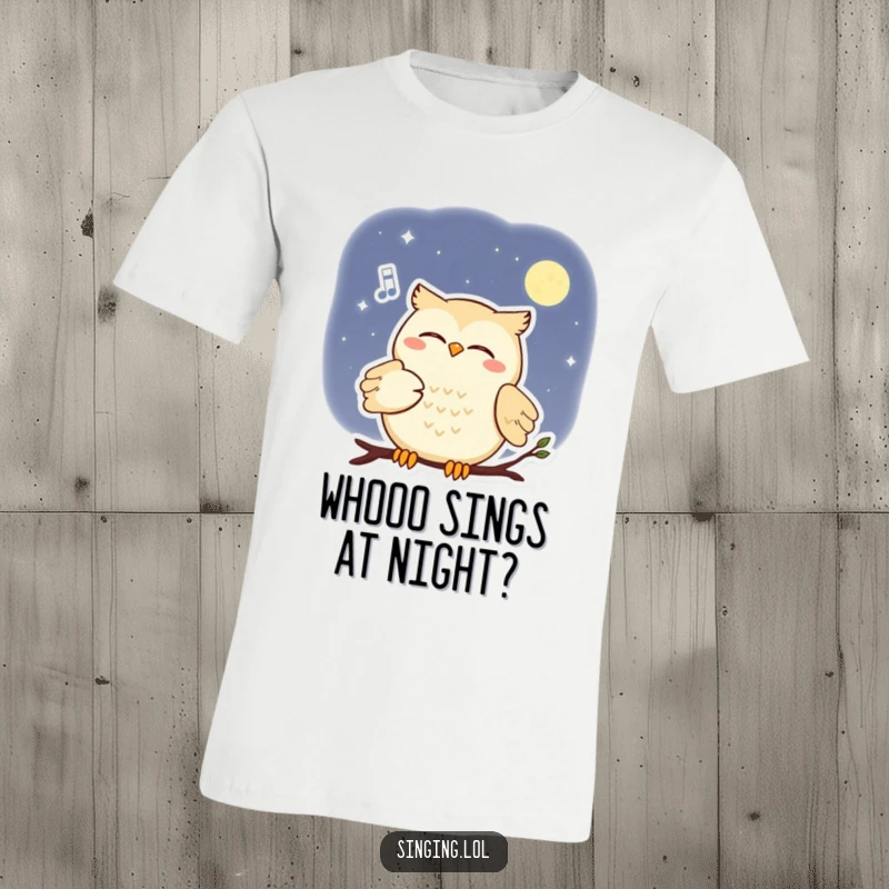 Funny t-shirt featuring a smiling owl serenading the moon with a soft melody, evoking nocturnal charm.