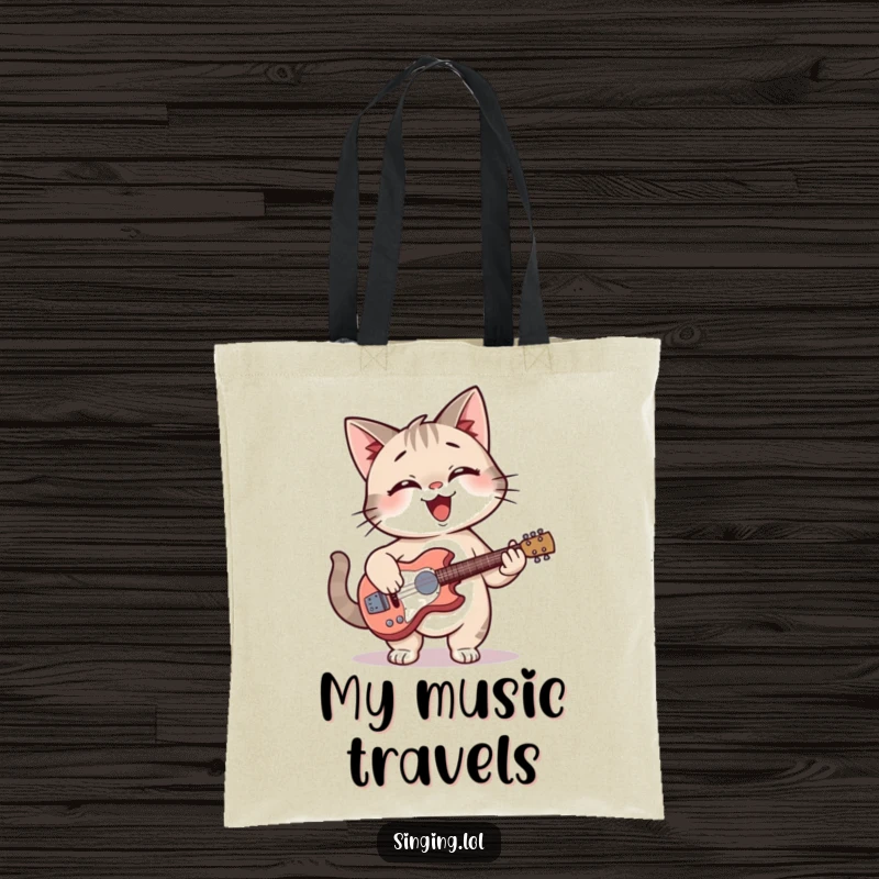 Funny cat giggling while playing a tiny guitar on a durable tote bag.